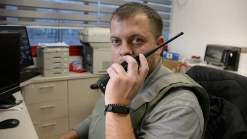 Man in bulletproof vest in security room. selective focus, Видео 172364792