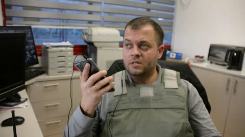 Man in bulletproof vest in security room. selective focus, Stock Footage 172364840