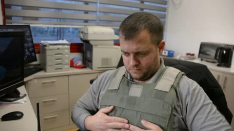 Man in bulletproof vest in security room. selective focus, Stock Footage 172364889