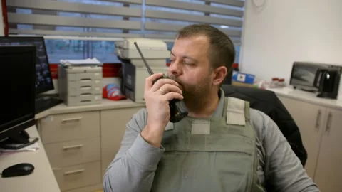 Man in bulletproof vest in security room. selective focus, Stock Footage 172364903