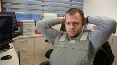 Man in bulletproof vest in security room. selective focus, Stock Footage 172365068