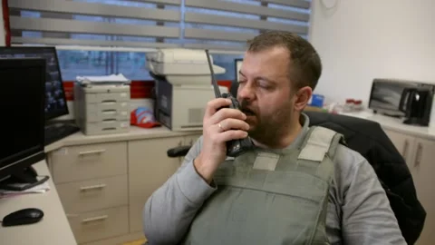 Man in bulletproof vest in security room. selective focus, Video stock 172365103