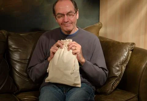 Man with burlap bag Stock Photos