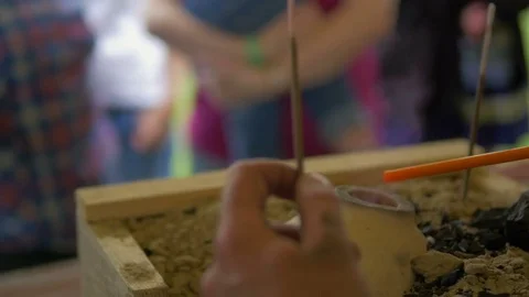 Man burns plastic stick on fire Stock Footage 82403295