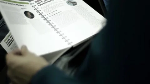 A man in a business center is sorting through papers about a business 스톡 동영상 137158233
