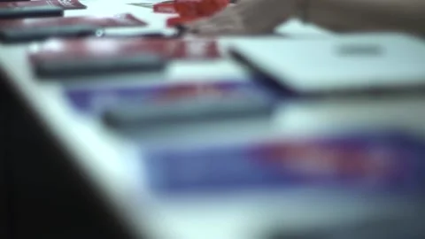 A man in a business center is sorting through papers about a business Stock Footage 137158257