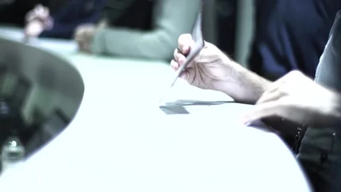 A man in a business center is sorting through papers about a business Stock Footage 137158299
