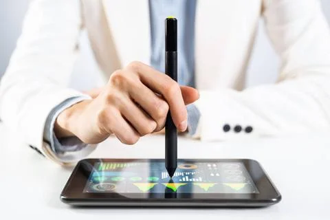 Man in business suit using tablet computer. Man in business suit using tab... Foto stock