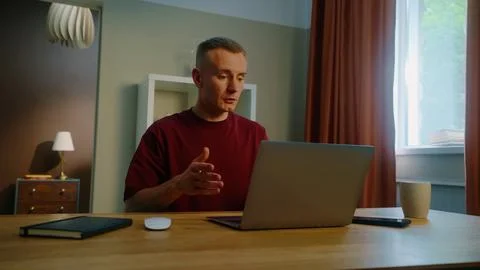 Man business worker remote hard work laptop home. Guy talk video call. Male e Stock Photos