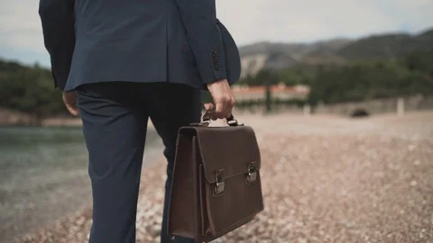 Man businessman returning home from work Stock Footage 100644012
