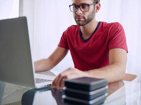 Man busy inserting a memory stick into his notebook Foto stock