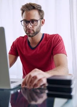 Man busy inserting a memory stick into his notebook 写真素材