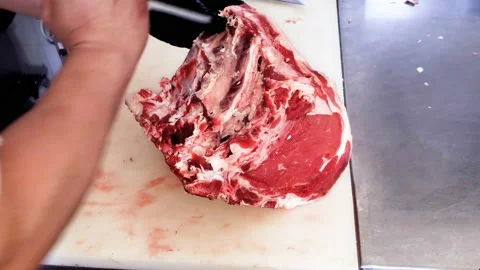 Man Butcher working on debone meat with disposal plastic gloves,people job 4k Stock Footage 132819309