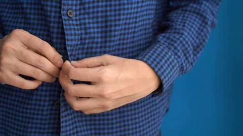 Man button blue and black plaid shirt in the morning Stock Footage 121165120