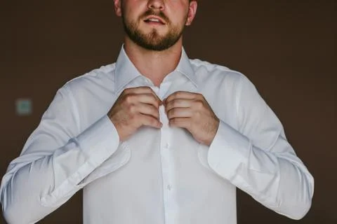 The man button buttons on white shirt Foto stock