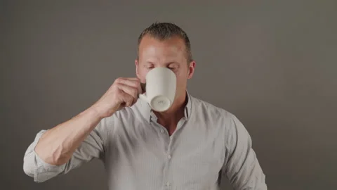 Man In Button Down Shirt Enjoys Coffee Stock Footage 208714908