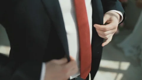 The man button up his jacket Stock Footage 75531826