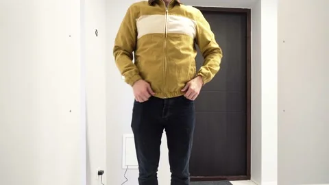 Man buttoned his jacket and close the Cupboard Stock Footage 132091271