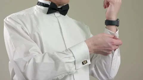 Man buttoning a cufflink on his shirt sleeve Stock Footage 160436652
