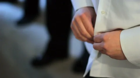 Man Buttoning Dress Shirt Stockbeeldmateriaal 58505103