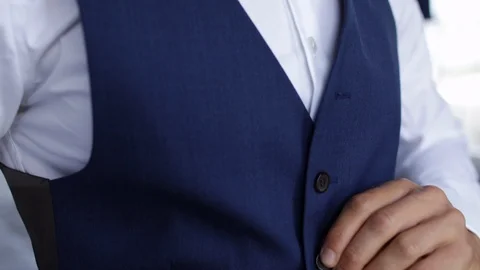 Man buttoning fancy blue vest 스톡 동영상 112767744