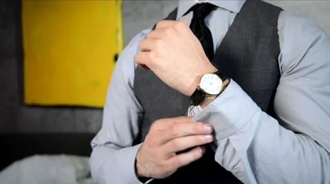 Man Buttoning his Shirt Cuff Stock Footage 68151834