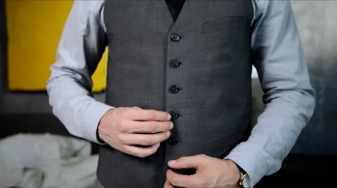 Man buttoning up his vest and straightening tie Stock Footage 68151836