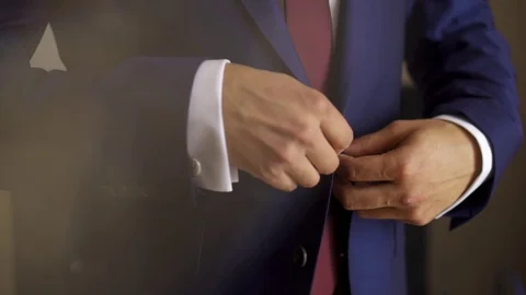 Man Buttoning A Jacket Blue Suit with a Red Tie and White Shirt Stock Footage 93259238