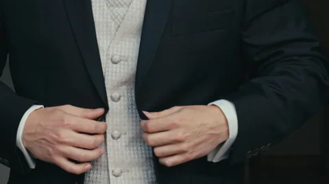Man buttoning on the jacket 스톡 동영상 68142734