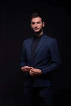 Man buttoning jacket suit Stock Photos