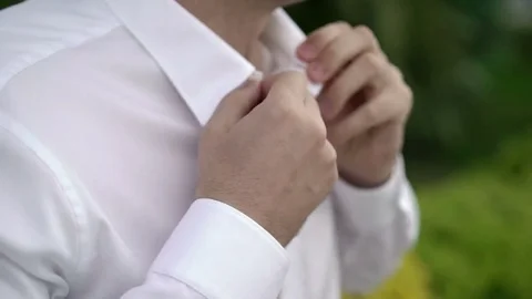 Man buttoning shirt Stock Footage 76103430