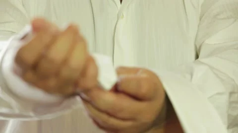 Man Buttoning Sleeves Of The Shirt Video stock 52574291