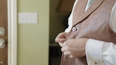Man Buttoning Vest Stock-Footage 47772866
