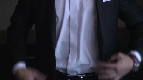 Man buttons his jacket Video stock 56576340