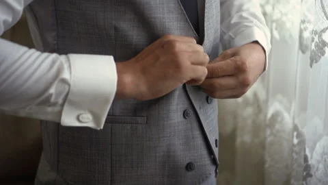 Man buttons up the suit Stock Footage 168313643