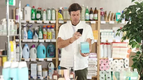 Man buyer scans qr code on liners label Stock-Footage 342126758
