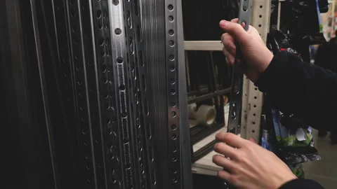 Man buying construction materials for making racks or furniture at store 4k Stock Footage 88142333