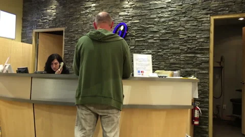 Man buying a eyeglasses at Image Optometry store Stock Footage 64862160
