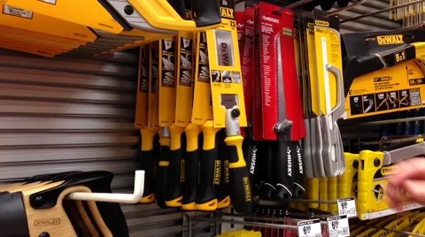 Man buying flush cut pull saw Stock Footage 53177560