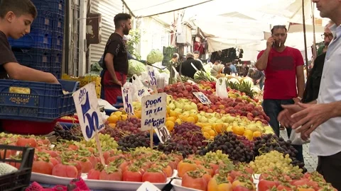 A man buying fruits from the traditional market (bazaar) in Istanbul Stock Footage 287362697