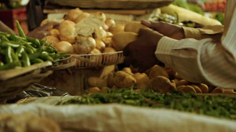 Man buying potatoes at vendor Stock Footage 32199233