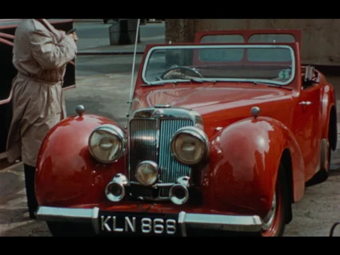 Man Buying Red Convertable Car Brighton UK 1950s 動画素材 277906914