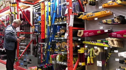 Man buying a ruler inside Home Depot store Stock Footage 57541454