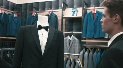 Man buys classic clothes and shoes in shop Stock Footage 66428152