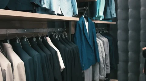 Man buys classic clothes and shoes in shop Stock Footage 66428196