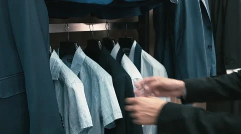 Man buys classic clothes and shoes in shop Video stock 66428201
