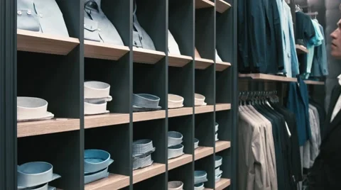 Man buys classic clothes and shoes in shop Video stock 66428258