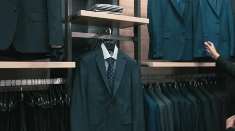 Man buys classic clothes and shoes in shop Stock Footage 66428279