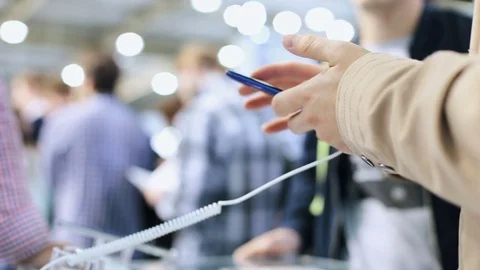 A man buys a smartphone in a store Stock Footage 81943727