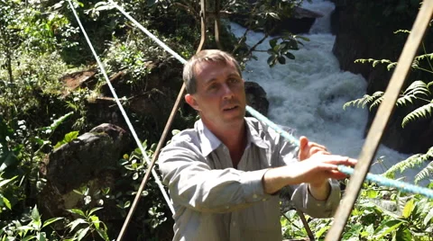 Man in Cable Car Over River Going Video stock 54802112
